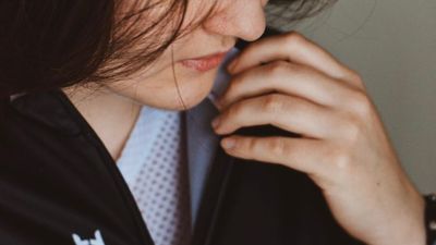 close up from a model wearing a black cycling jerseys and base layer