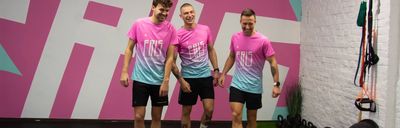 Fris Coaching Team wearing custom sportswear with gradient running shirts during indoor training session