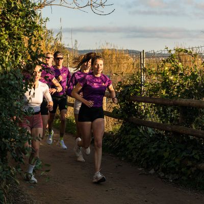 Custom running jersey with team logo and purple design from the PTC team – TD Sportswear