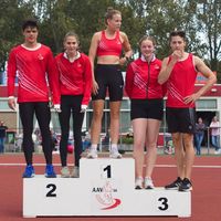AAV 36 athletes wearing custom running clothing in red standing on podium during track event